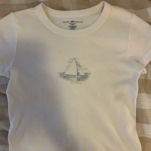 Brandy Melville Ashlyn top John galt white with small blue sail boat